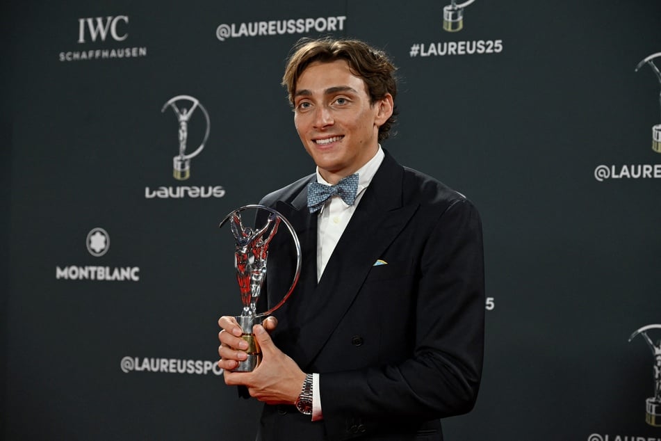 Swedish pole vaulter Armand Duplantis poses with the Sportsman of the Year award during the 26th Laureus World Sports Awards gala in Madrid on April 21, 2025.