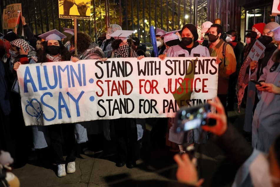 Columbia University students and alumni protest the suspension of the campus' Students for Justice in Palestine and Jewish Voice for Peace chapters.