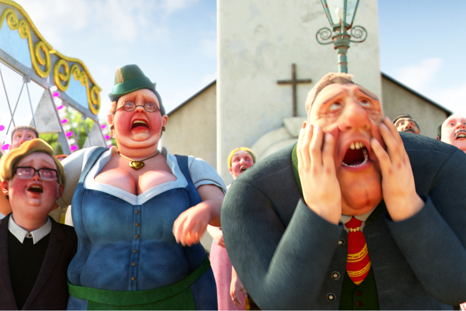 Der Bürgermeister (v.-r.), seine Frau (M.) und ihr Sohn Fridolin (l.) staunen nicht schlecht, wie die neu gestaltete Fassade vom Rathaus von Siegheilkirchen aussieht.
